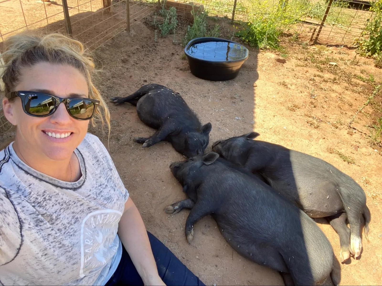 The founder with one of the rescue pigs at the sanctuary.