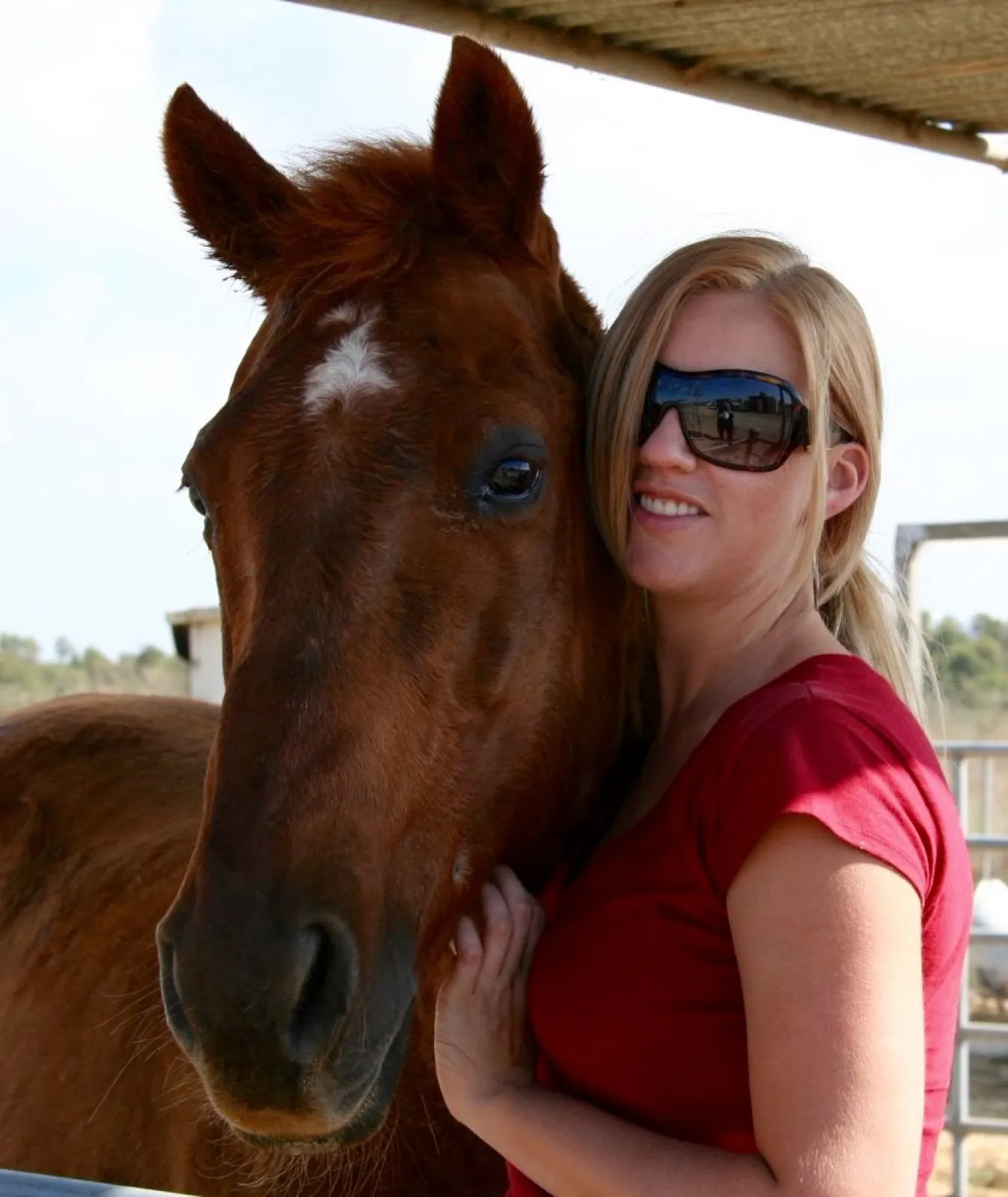 The founder as a young adult cheek-to-cheek with her chestnut horse — Kimber and Doc in 2007.
