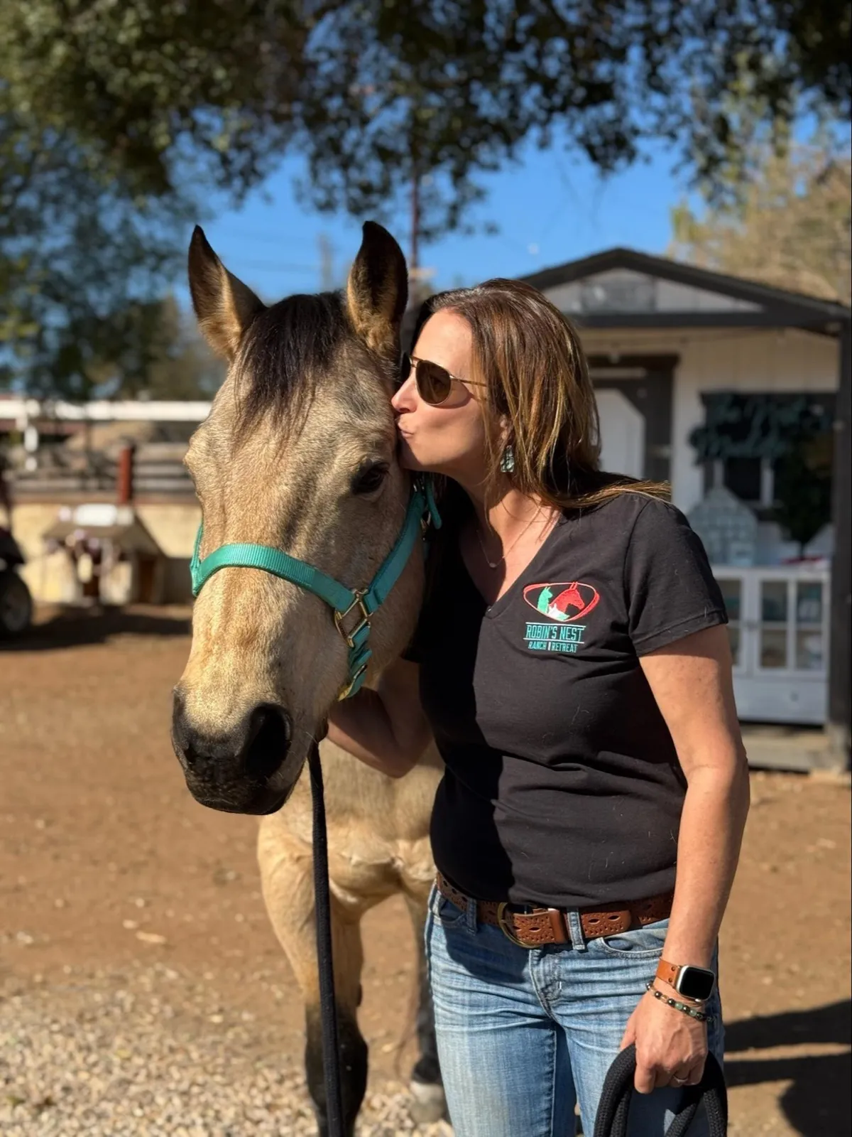 A Side by Side visitor sharing a quiet moment with one of the rescue animals.