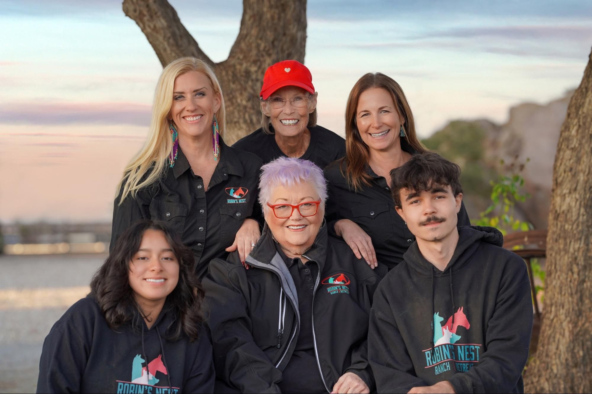 The Robin's Nest Rescue team gathered together at the sanctuary at sunset.