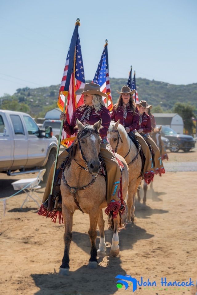Equestrian performer riding a horse during a Temecula Cowgirls performance.